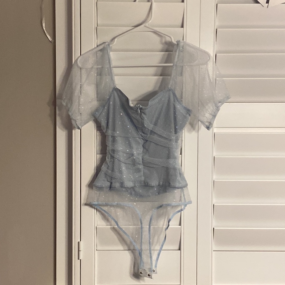 Excellent condition size Medium. Body suit.